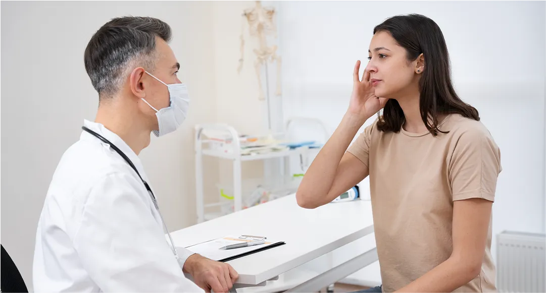 Doctor assessing vertigo symptoms in tourist at Bali clinic.